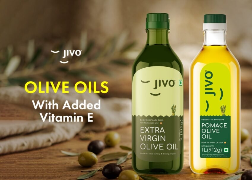 Two bottles of Jivo olive oil, including Extra Virgin Olive Oil and Pomace Olive Oil with added Vitamin E.